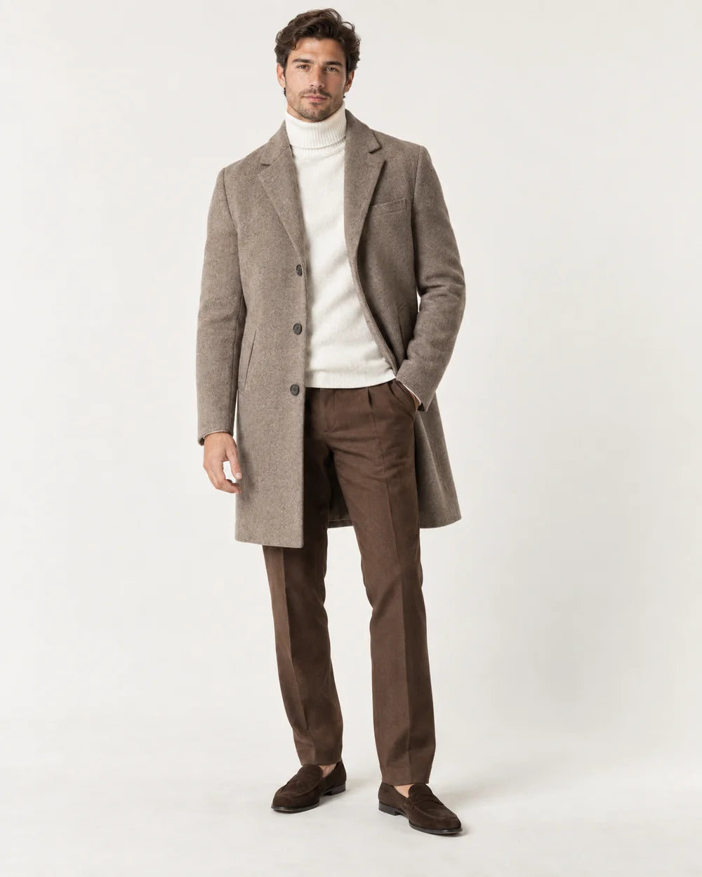 Man in a fall/winter coat walking through an open doorway