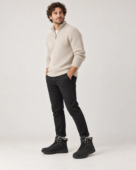 Garrick men's black plush lined lace-up winter ankle boots, three-quarter side view while walking
