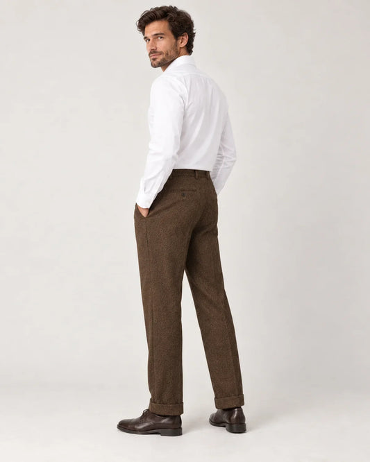 Sinclair men's herringbone pleated straight-leg trousers in Brown, side view on a model
