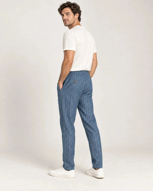 Whitfield men's pinstripe tapered trousers in Blue, side view on a model