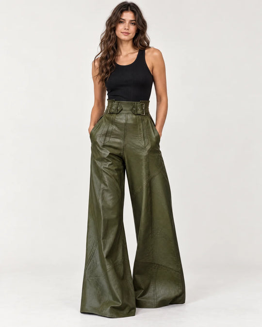 Amalie women's high-waisted wide-leg pants in dark green with a wide belted waistband, front view on a model