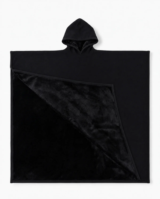 Juna oversized hooded blanket in black, laid flat on white with the hood visible