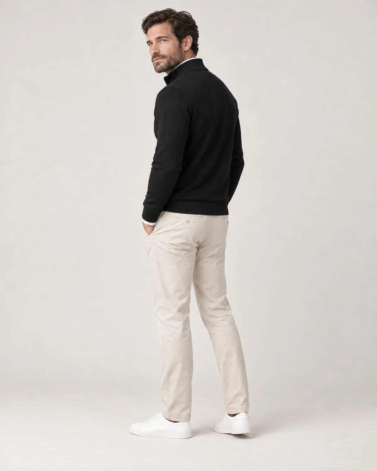 Ansel men's half-zip sweater with stand collar in Black, side view on a model
