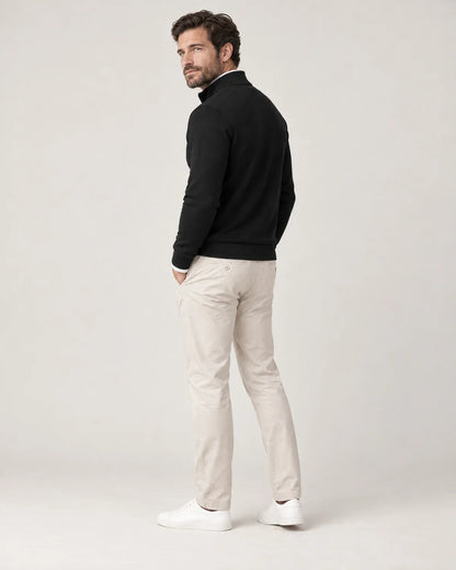 Ansel men's half-zip sweater with stand collar in Black, side view on a model