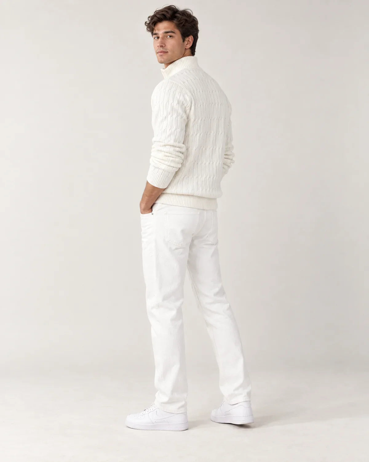 Emory men's cable knit quarter-zip sweater with funnel neck in White, side view on a model