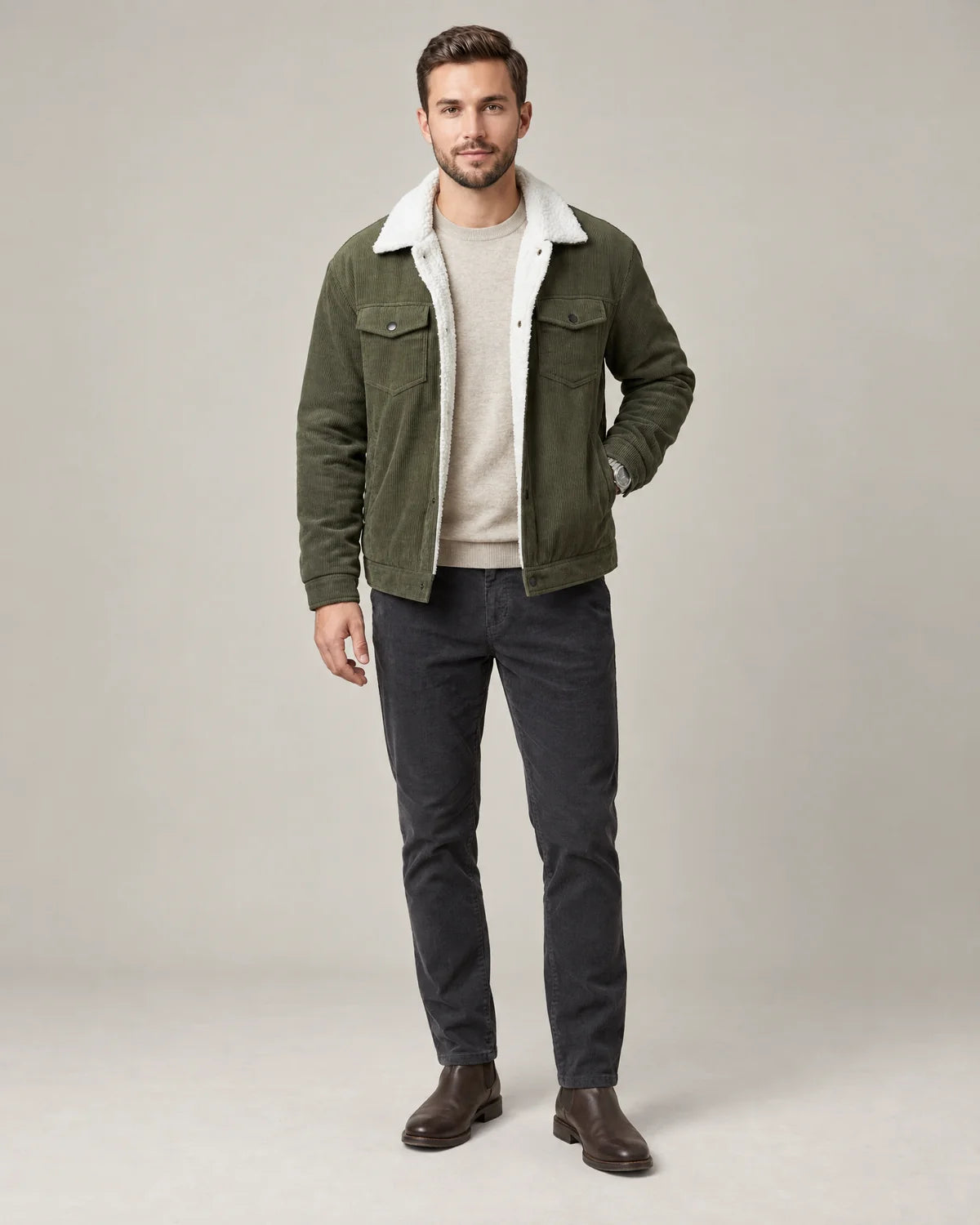 Everett men's corduroy sherpa lined trucker jacket in army green, front view worn open over an oatmeal sweater