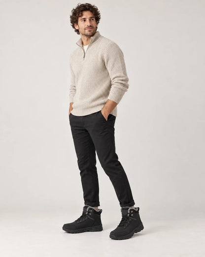 Garrick men's black plush lined lace-up winter ankle boots, three-quarter side view while walking
