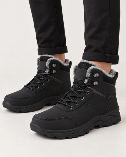 Garrick men's black plush lined winter boots, close-up of the plush collar, speed hooks and lug sole