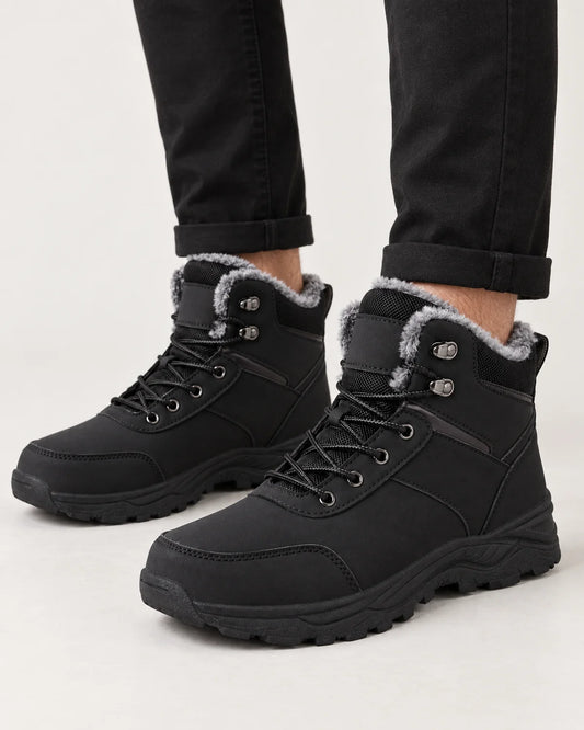 Garrick men's black plush lined winter boots, close-up of the plush collar, speed hooks and lug sole