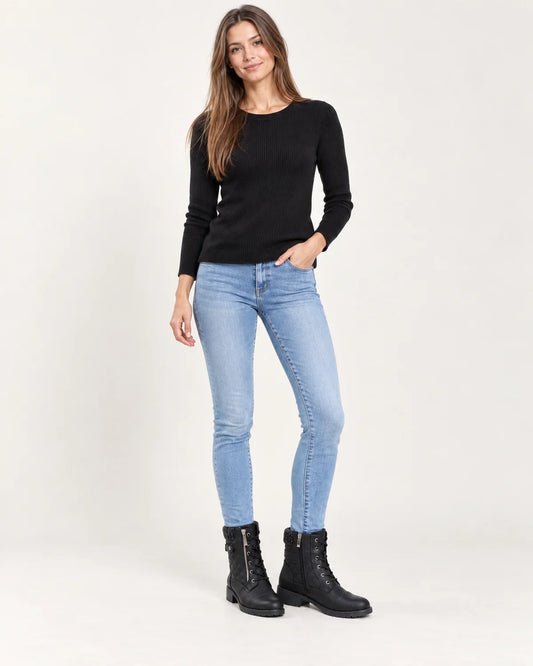 Liesel women's quilted lace-up ankle boots in black, full-length front view with skinny jeans