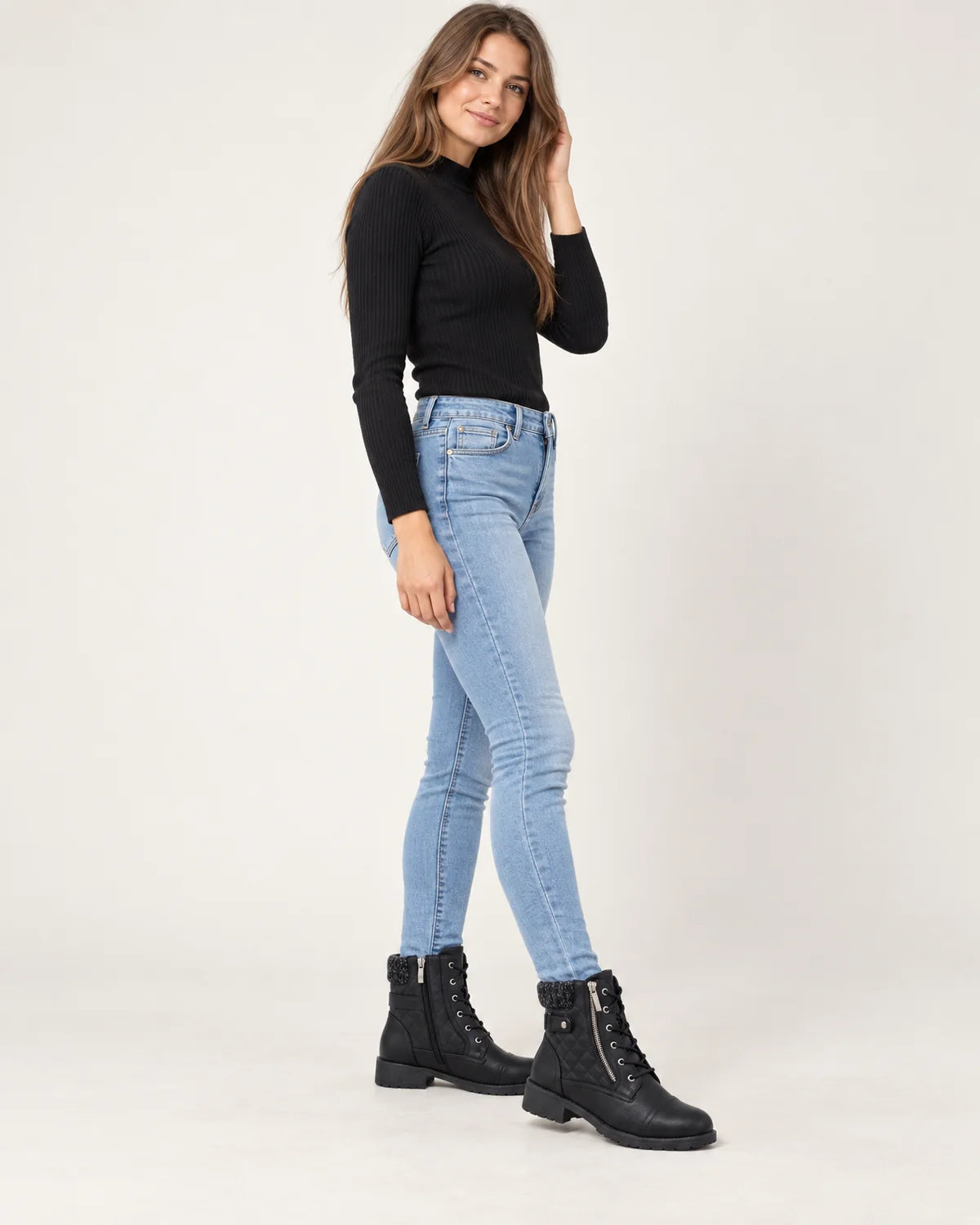 Liesel women's quilted lace-up ankle boots in black, side view showing the outer zip and knit collar