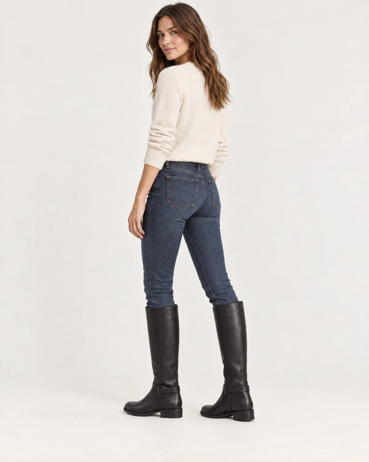 Linnea women's knee-high riding boots in Black, side view on a model
