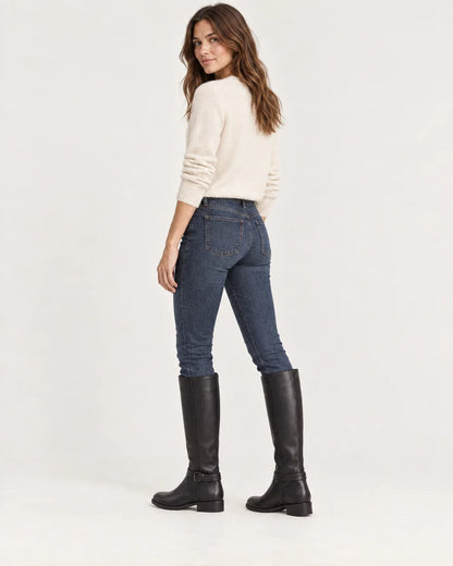 Linnea women's knee-high riding boots in Black, side view on a model