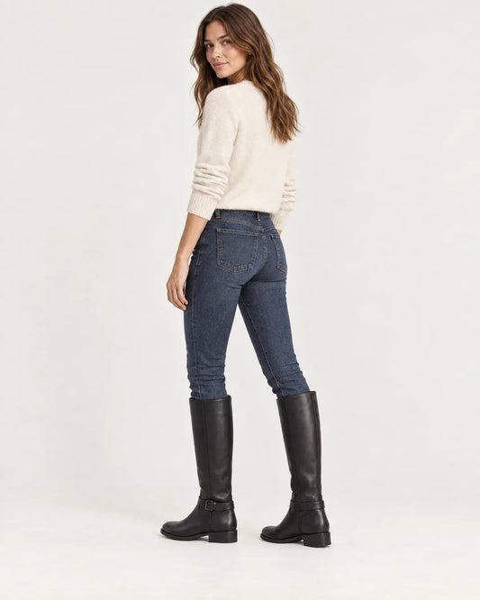 Linnea women's knee-high riding boots in Black, side view on a model