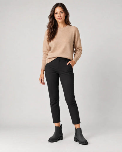 Maren women's black Chelsea boots with chunky lug sole, full-length front view with cropped black trousers