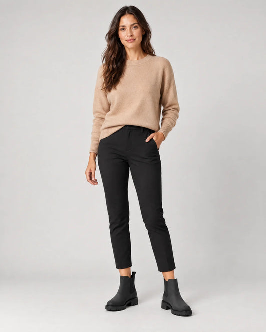 Maren women's black Chelsea boots with chunky lug sole, full-length front view with cropped black trousers