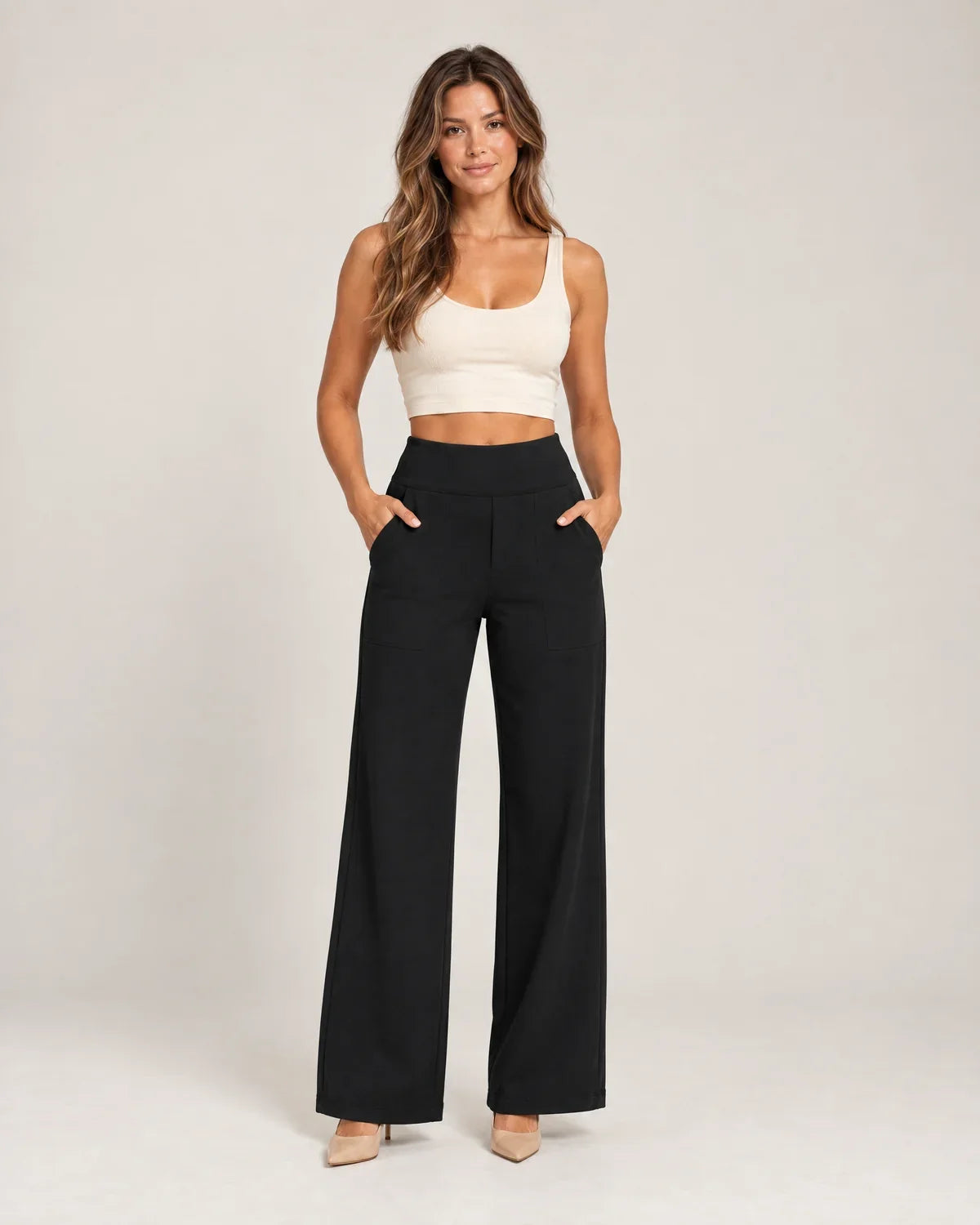 Willemijn women's high-waisted pull-on pants with pockets in black, front view on a model