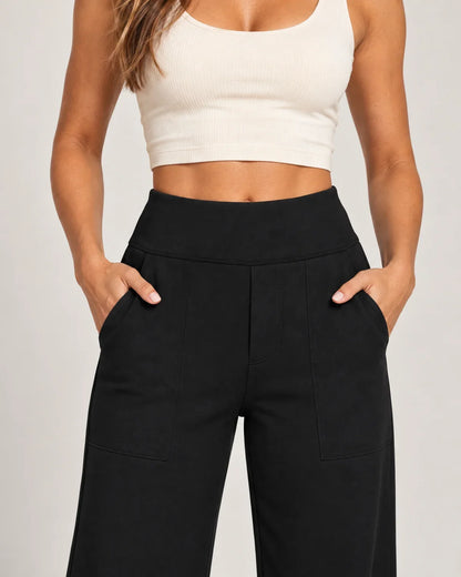 Willemijn women's high-waisted pull-on pants in black, close-up detail of the waistband and pocket
