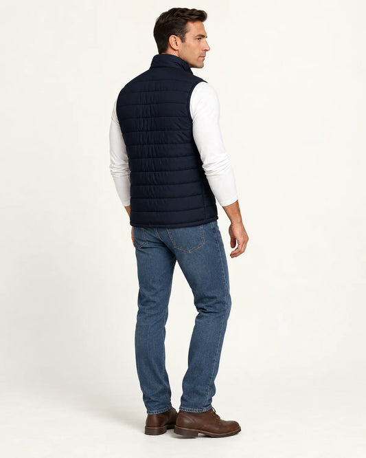 Rowan men's quilted puffer vest in navy, three-quarter back view showing the horizontal quilting