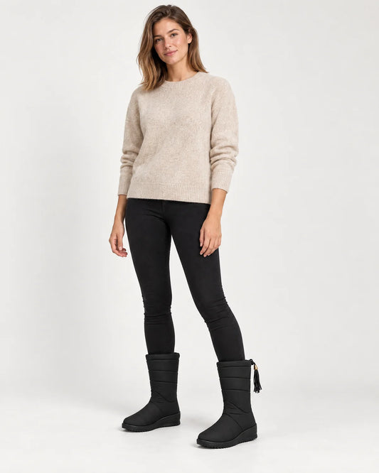 Sigrid women's quilted mid-calf winter boots with tassel tie in Black, front view on a model