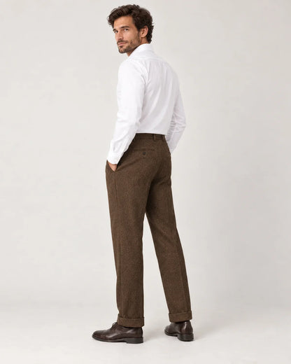 Sinclair men's herringbone pleated straight-leg trousers in Brown, side view on a model