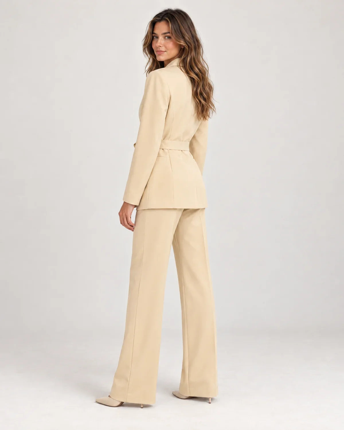 Solene women's belted blazer and wide-leg trouser suit set in Beige, side view on a model