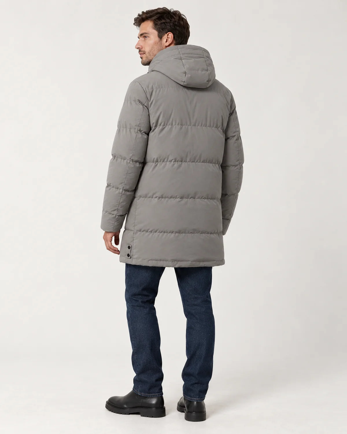 Thorne men's hooded longline padded parka in grey, three-quarter back view showing the hood and length