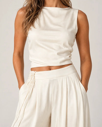 Odalie women's open-back crop top and wide-leg pant set in ivory white, close-up detail of the tie fastening