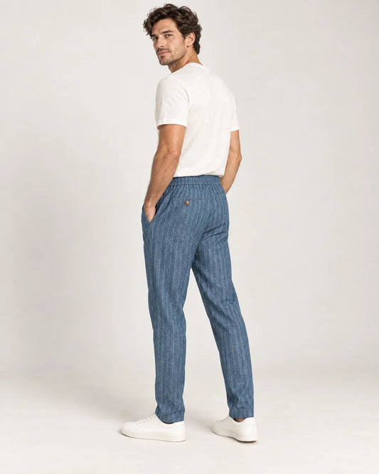 Whitfield men's pinstripe tapered trousers in Blue, side view on a model