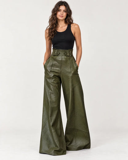 Amalie women's high-waisted wide-leg pants in dark green with a wide belted waistband, front view on a model