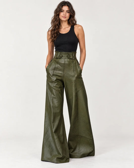 Amalie women's high-waisted wide-leg pants in dark green with a wide belted waistband, front view on a model
