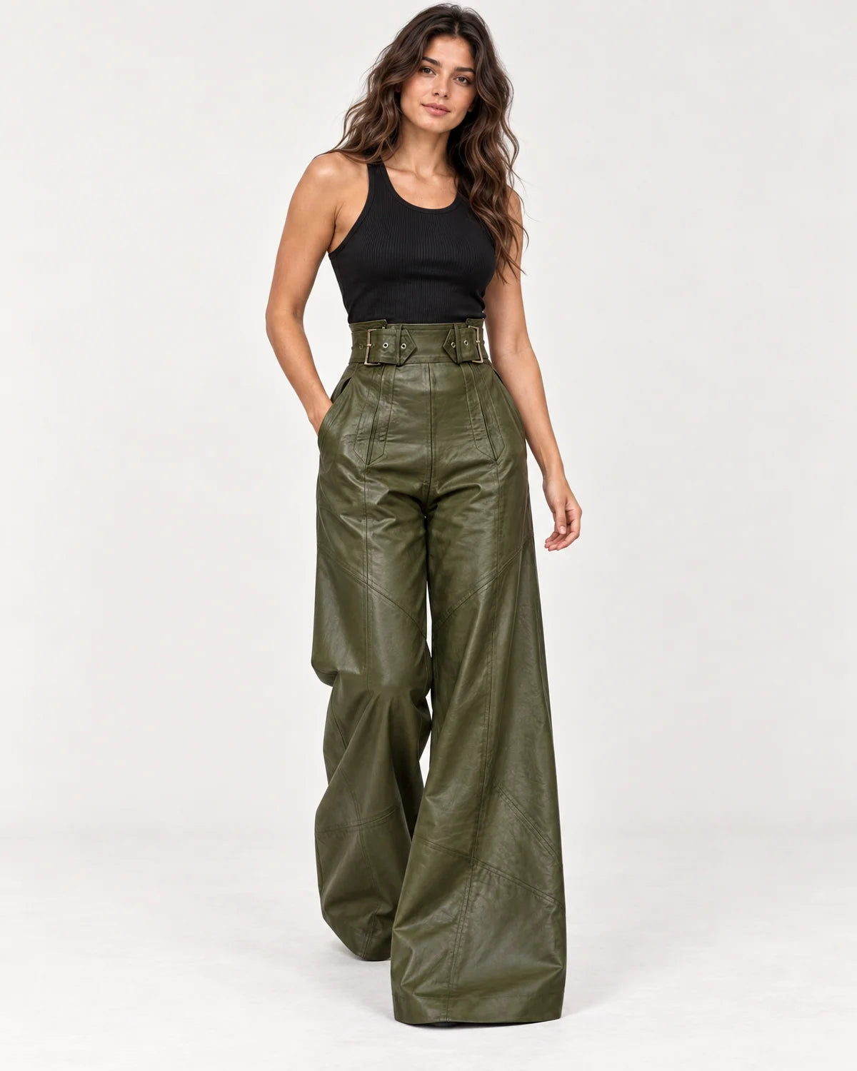 Amalie women's high-waisted wide-leg pants in dark green, three-quarter walking view with the two-buckle belted waistband